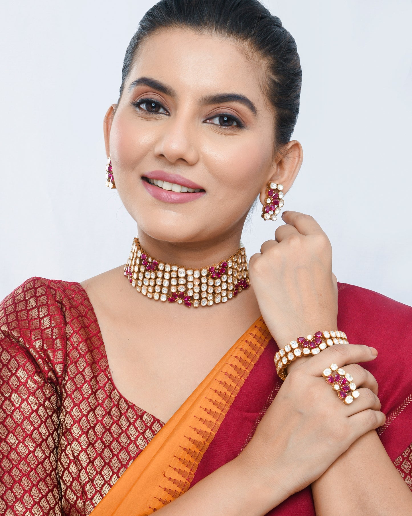 Royal polki set with ruby flowers, a complete set with studs and bracelet - Yuvaminie