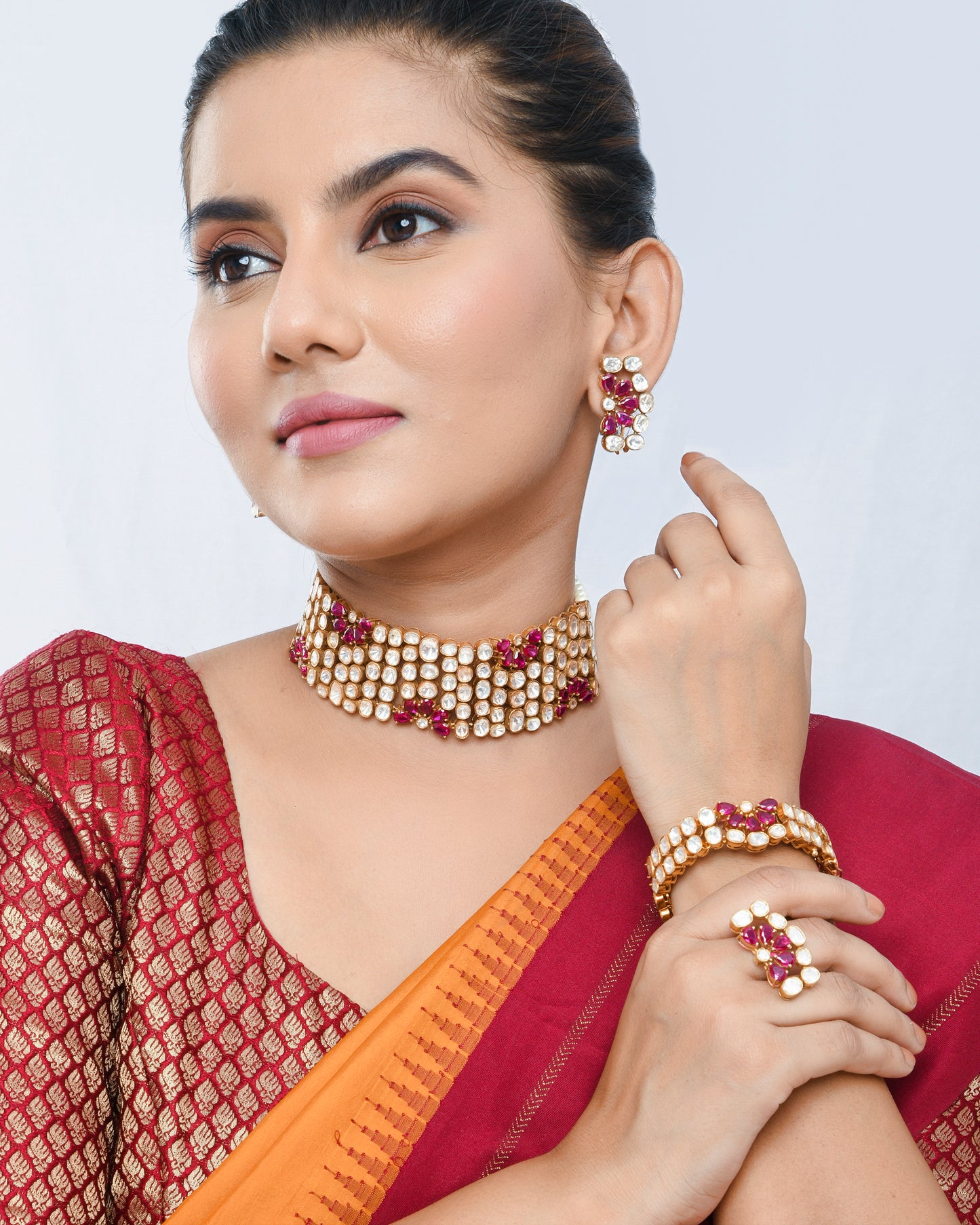 Royal polki set with ruby flowers, a complete set with studs and bracelet - Yuvaminie