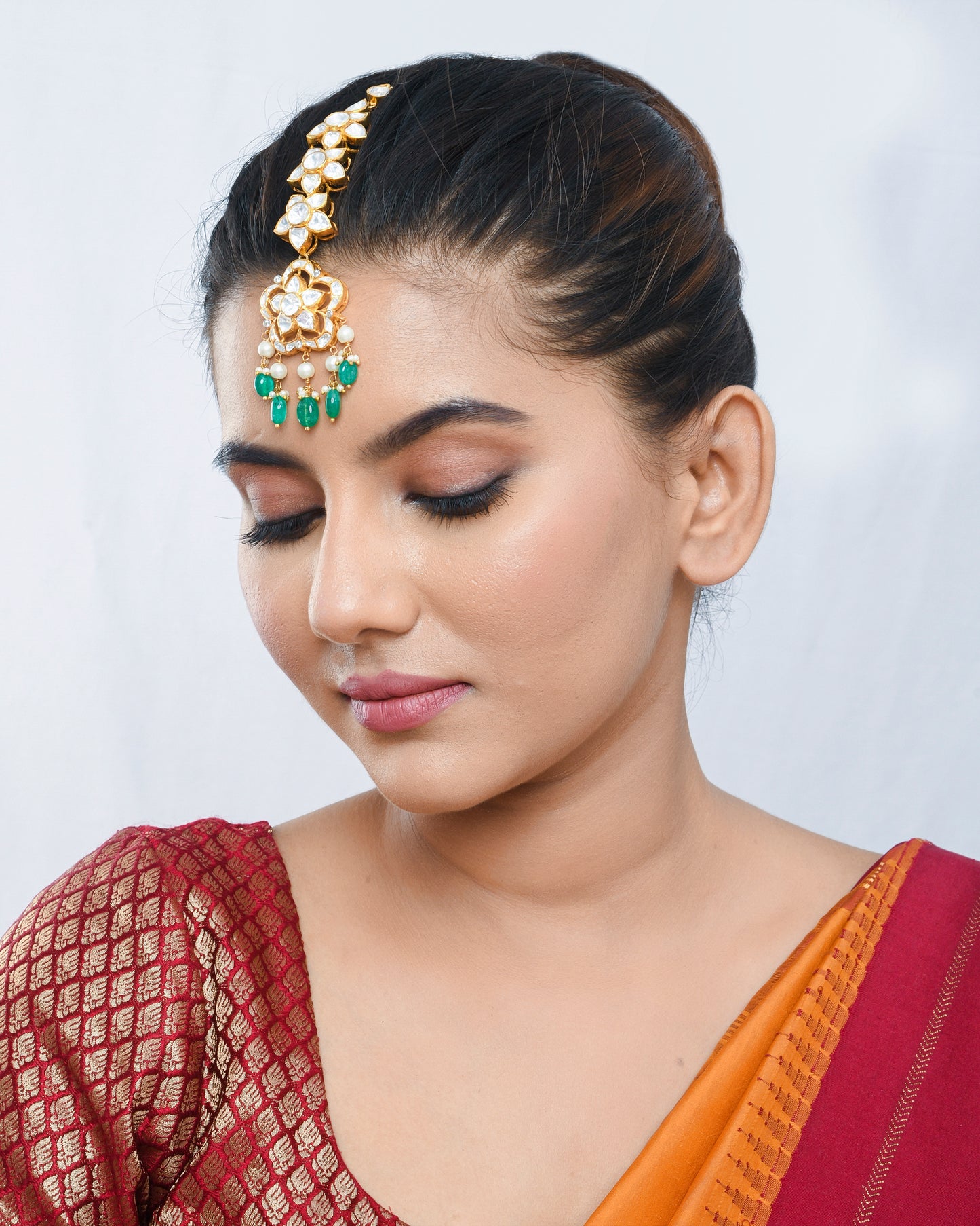 Phool patti Maang teeka in green beads & Polki stones - Yuvaminie