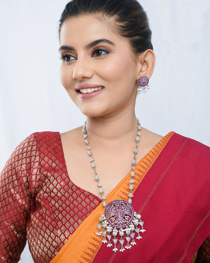Oxidised silver peacock motif necklace set with magenta accents - Yuvaminie
