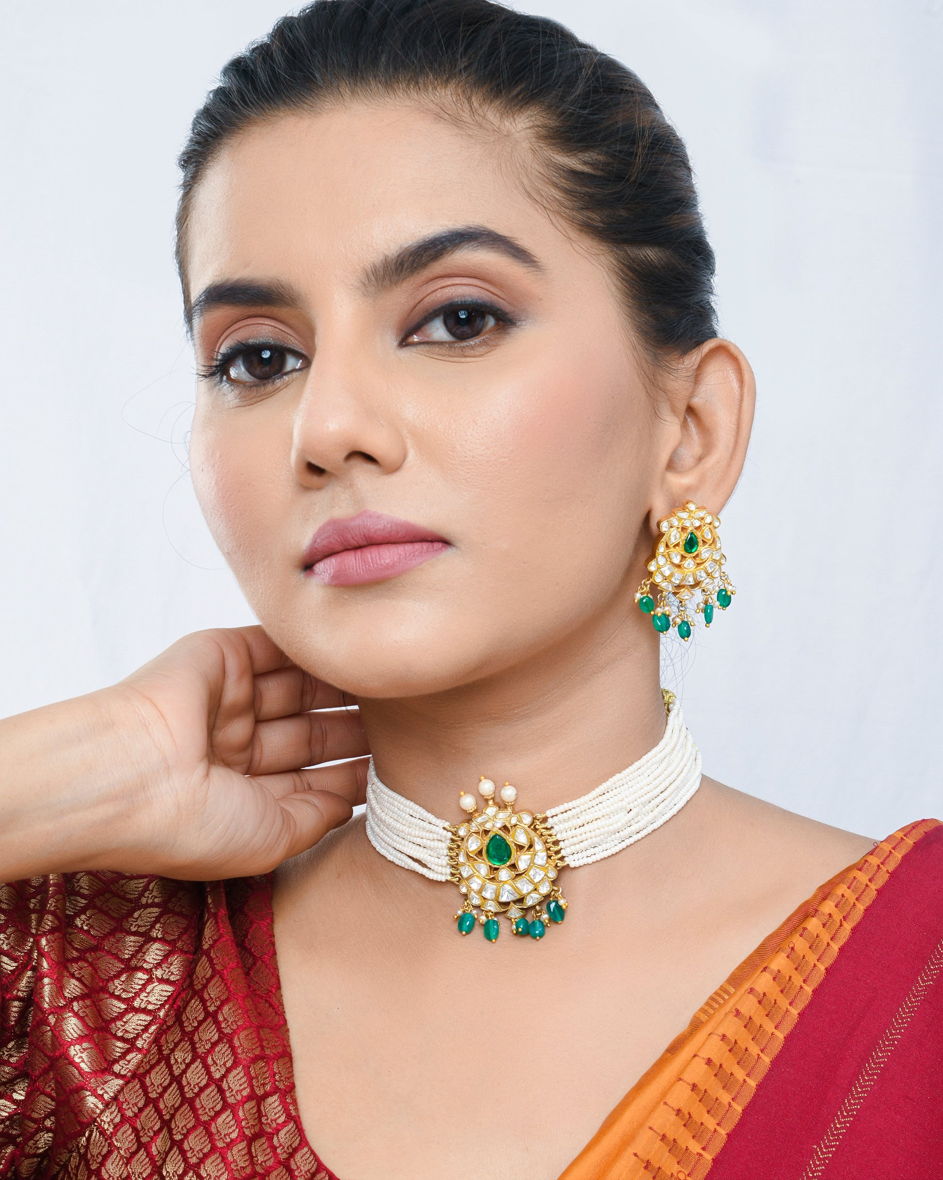 Pearl beaded kundan style necklace set with green stones pendant and earrings - Yuvaminie