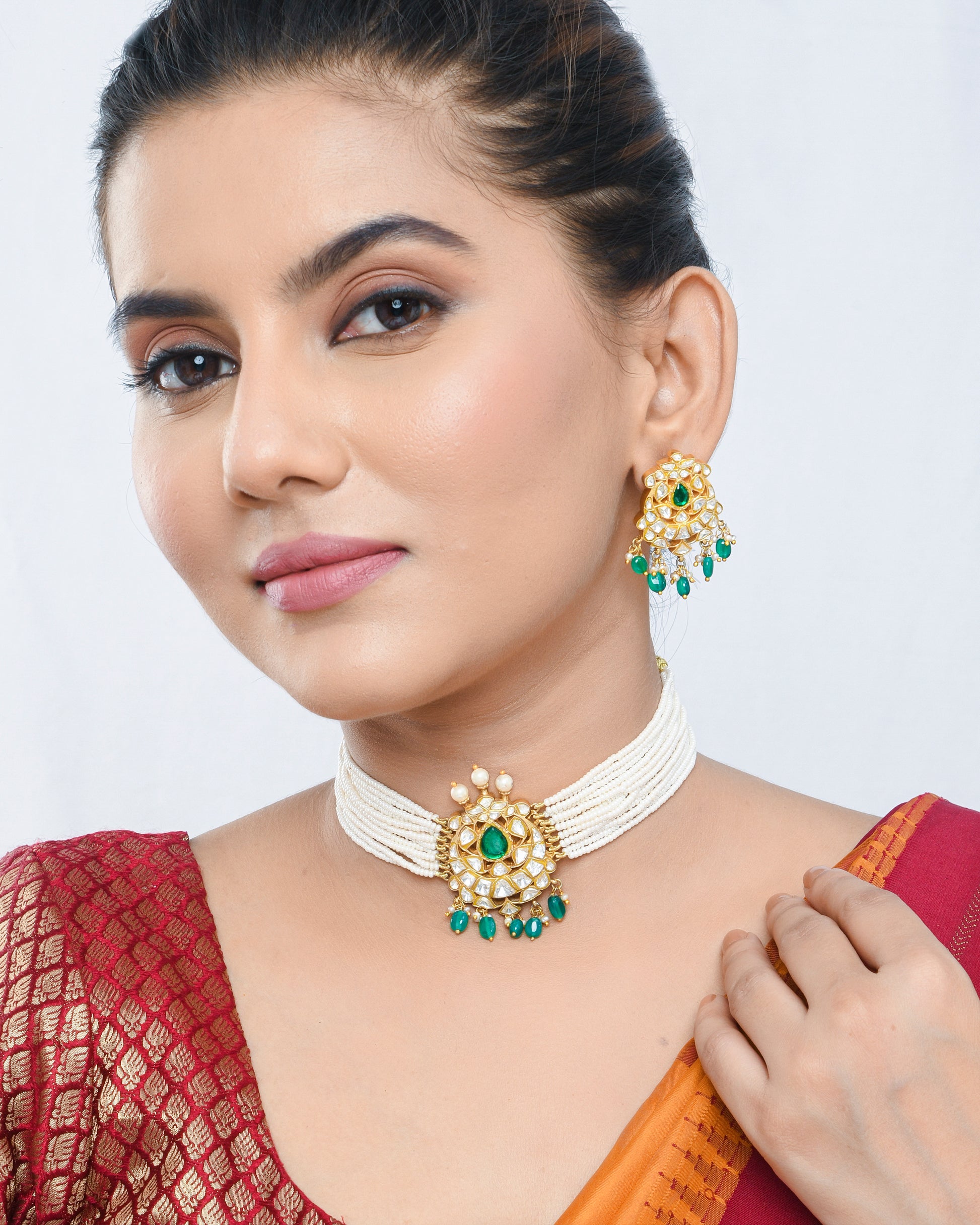 Pearl beaded kundan style necklace set with green stones pendant and earrings - Yuvaminie