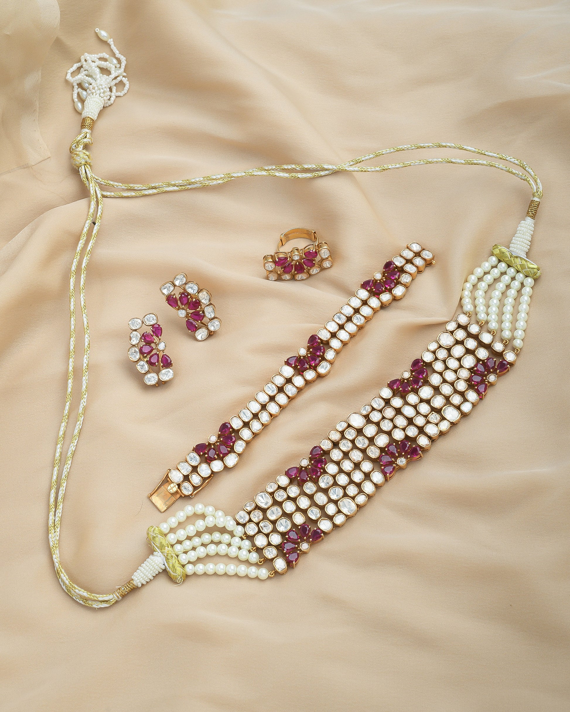 Royal polki set with ruby flowers, a complete set with studs and bracelet - Yuvaminie