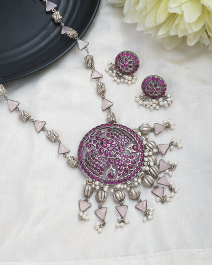 Oxidised silver peacock motif necklace set with magenta accents - Yuvaminie