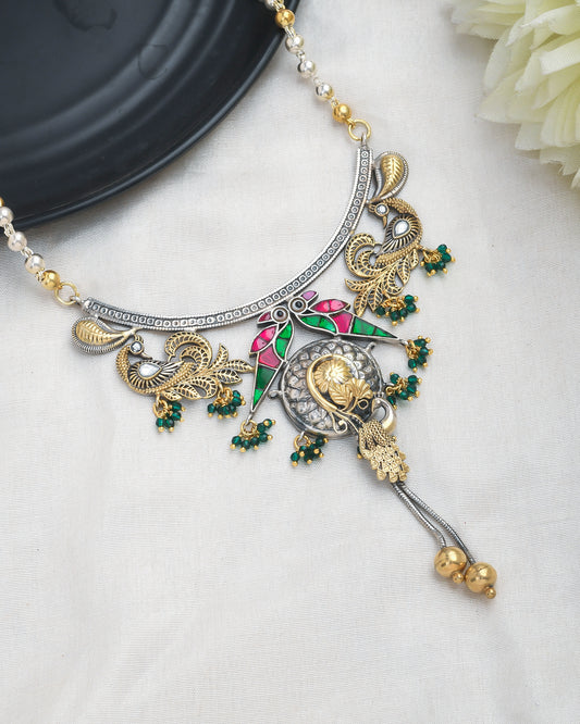 Peacock motif oxidised silver long necklace with enamelling gold accents - Yuvaminie
