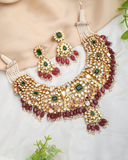 Grand kundan bridal necklace set with emerald and emerald stones and red strawberry beads - Yuvaminie